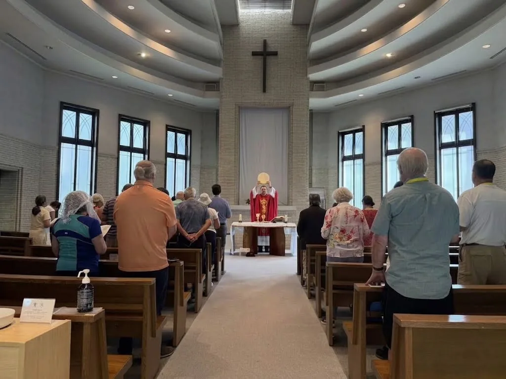 Pilgrims celebrating Mass inside a Catholic church